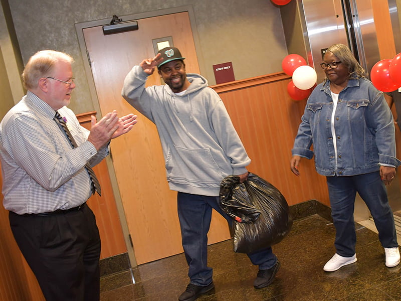 Larry McKnight, vice president of long-term care for Methodist Rehabilitation Center in Flowood, was among a crowd of well-wishers who greeted Michael Jordan and his mother, Mary Jordan, as they prepared to leave Methodist Specialty Care Center. Photo by Carey Miller/Methodist Rehabilitation Center