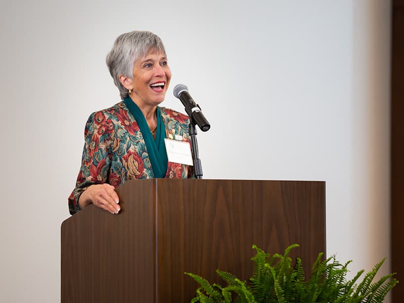 Dr. Barbara Mauldin standing behind podium.