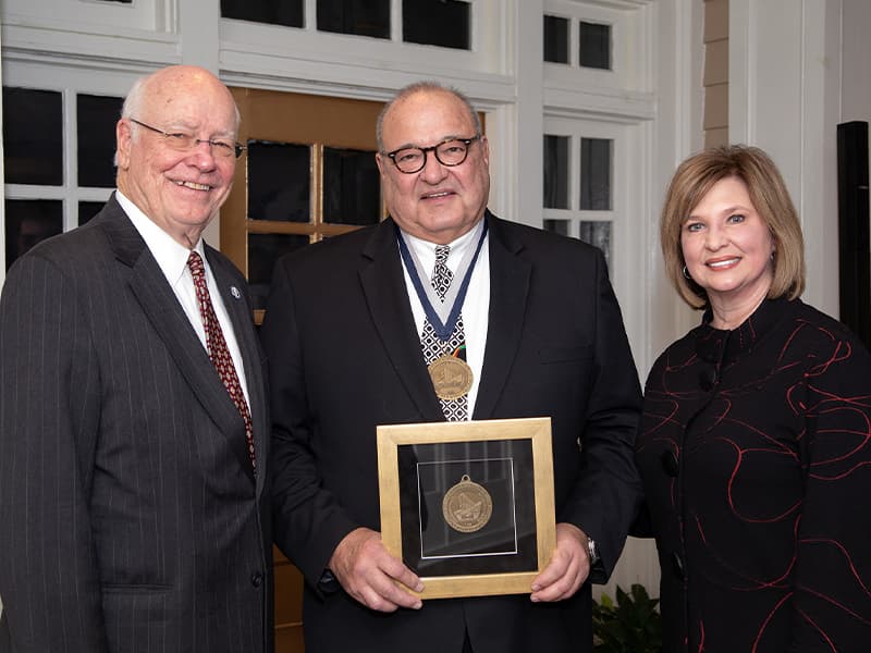 Group photo of Dr. Mark Barraza with award.