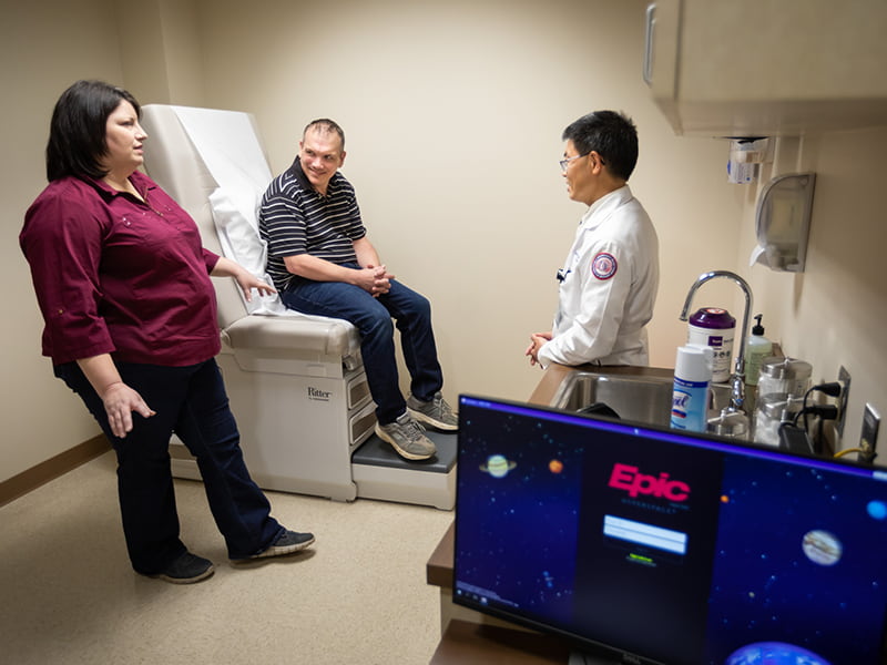 Doctor and patient discuss treatment plan.