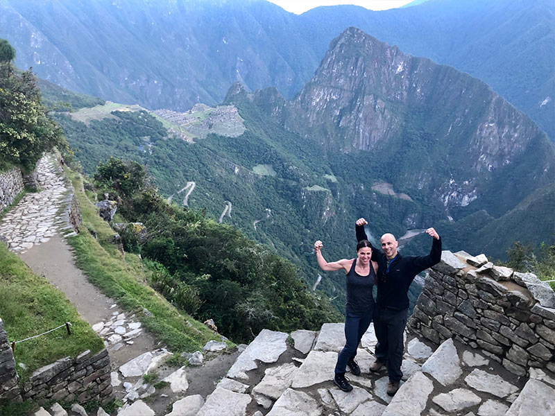 Man and woman on top of the Andes Mountains