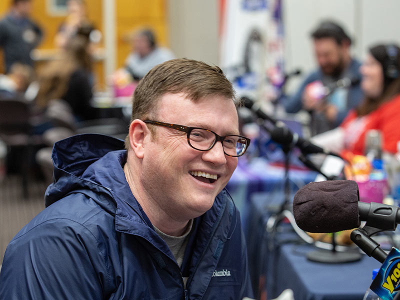 Dr. Brad Ingram, associate professor of pediatric neurology and director of the Pediatric Comprehensive Epilepsy Program at Children's of Mississippi, speaks on air during this year's Mississippi Miracles Radiothon.