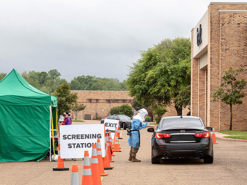 Medical Center staff collects specimen samples from Vicksburg-area residents Tuesday at a drive-through collection site at Pemberton Mall off Halls Ferry Road. One-day mobile operations for specimen collections continue around the state into early next week.