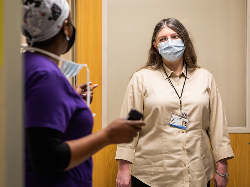 Dr. Joy Houston, right, prepares to see patients in the Adult Emergency Department in coordination with Tomika McLaurin, nurse.