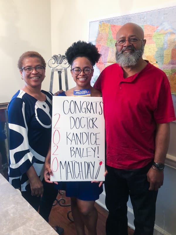 Kandice Bailey's parents, KaSandra and Curtis Bailey, help her celebrate Match Day in March.