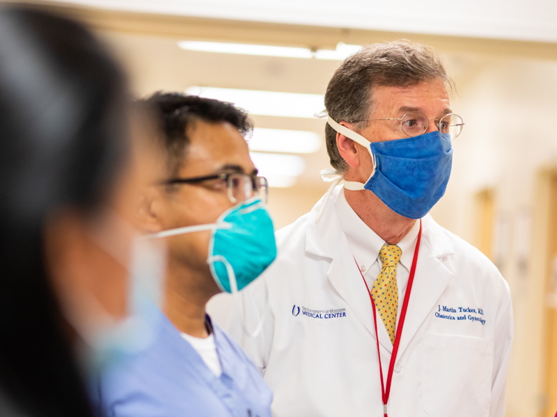 Dr. Marty Tucker, professor and chair of the Department of Obstetrics and Gynecology, takes part in rounds on the Labor and Delivery floor.