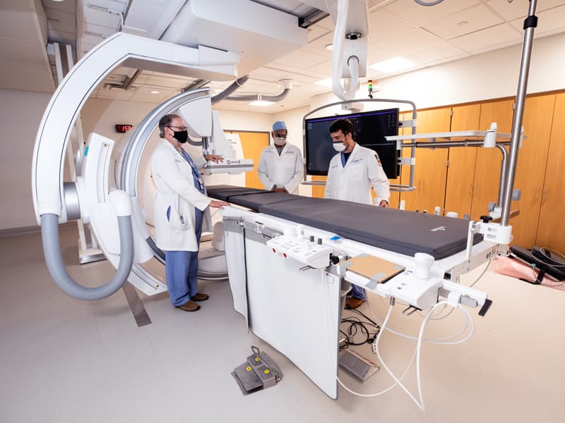 Seeing patients in the new Interventional Radiology Suite beginning in September are, from left, Dr. Timothy McCowan, Department of Radiology chair; Dr. Akash Patel, chief of the Division of Interventional Radiology; and Dr. J. Henry Williams, interventional radiologist.