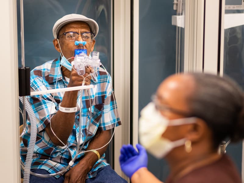 With help from Kimberly Lockett, pulmonary respiratory therapist, Sammie Bass of Jackson undergoes pulmonary function testing to gauge how well he can breathe.