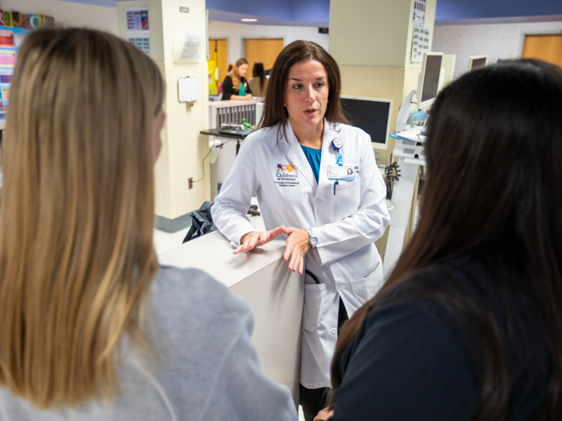Dr. Lisa Didion, center, speaks with Registered Nurses Lauren Girod, left, and Megan Roberts.