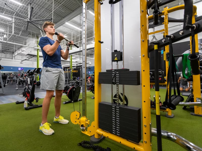 Jack Houston, a junior at Madison Central High School, lifts weights four times a week at Club 4 Fitness in Madison.