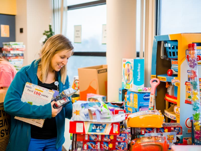 Child Life specialist Tiffany Key sorts toys donated to Children's of Mississippi patients, helping make the season bright during the 2019 holiday season.