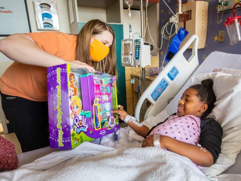 During her stay at Children's of Mississippi, Brooklyn Young of Madison receives a toy from a child life specialist.