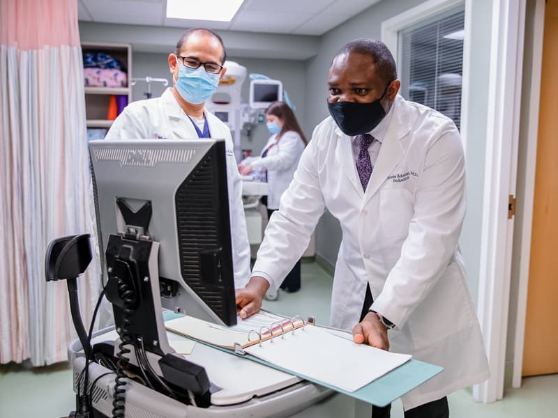 UMMC's Dr. Ram Kalagiri, left, and Dr. Kehinde Adebisi discuss treatment plans at the Delta Health System Medical Center NICU.