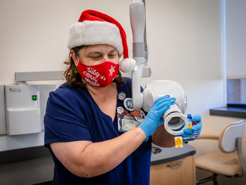 Dental assistant Angela Bilbro won first place in the School of Dentistry's mask-decorating contest with her "Baby, it's COVID outside" mask.