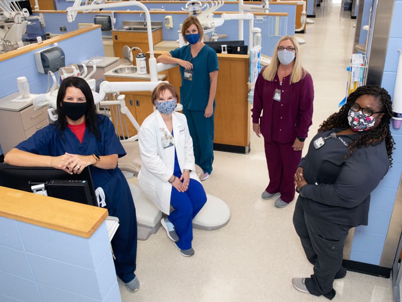 From left, Cynthia Senior, Sandra Horne, Elizabeth Carr, Barbara Brent and Angie Garner work in the Thoracic Oncology Clinic with Moremen's patients after their surgeries.