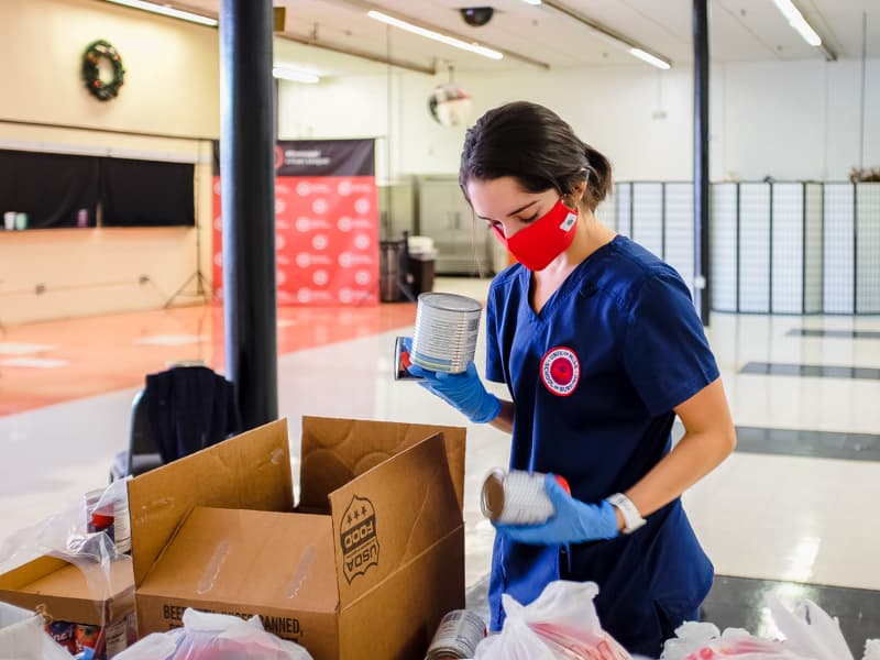 Kristen Hale, an EversCare food pantry volunteer from the School of Nursing, helps sort canned foods.