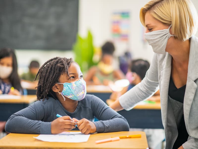 Attending school and child care centers while following CDC-recommended guidelines is less risky than attending social gatherings, according to a study led by UMMC experts. Photo copyright Getty Images.