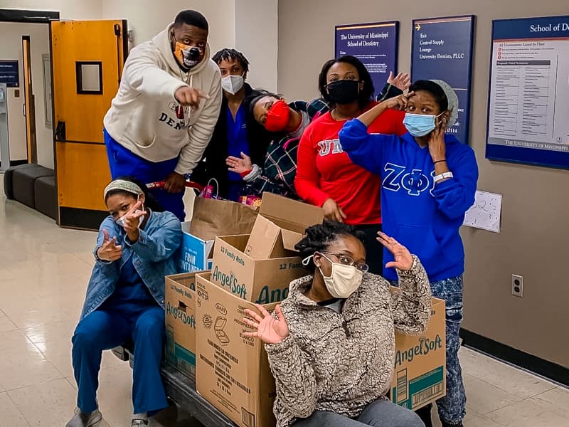 Members of the Student National Dental Association at the School of Dentistry, from left, Ashley Saulsberry, Johntre Goudy, Aaron Winters, Teleshia Johnson, Courtney Jones, Ericka James and SheKerra Dawkins-Strong, held a holiday food drive.