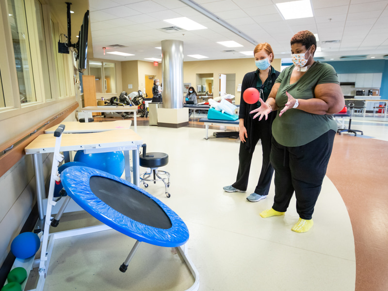 Stringer works on her coordination during an occupational therapy session with Skylar Menist at Methodist Rehabilitation Center.