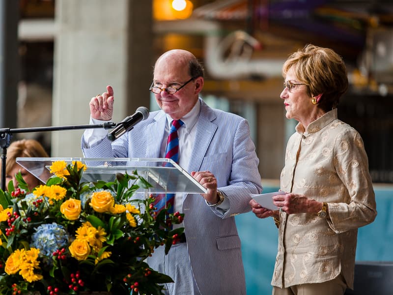 Joe and Kathy Sanderson speak during the program celebrating the Sanderson Tower reaching its full seven stories in 2019.