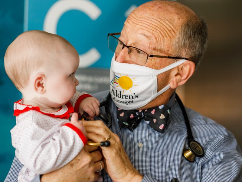 Vivi Hebert of Brandon, a Children's of Mississippi patient, visits with her cardiologist, Dr. William Moskowitz.