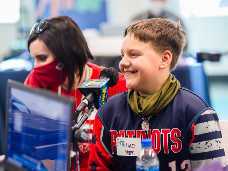 Lucas Mann of Brandon and his mother, Faith, enjoy chatting on the air with radio personalities.