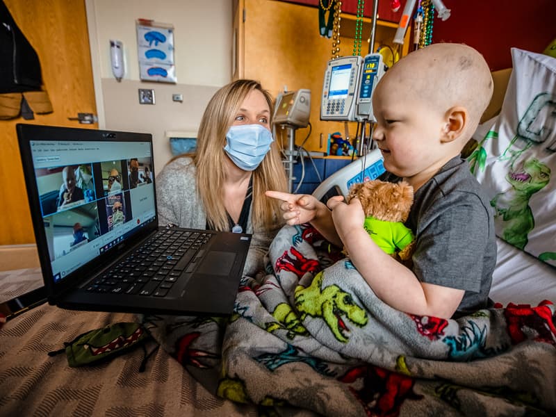 Because of the pandemic, Cash Ward of Summit couldn't come down to meet radio personalities, so they chatted online. Looking on is Tiffany Key, child life specialist.