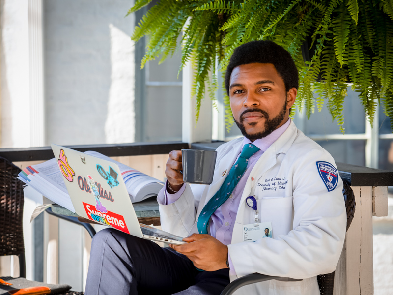 C.J. Lowe enjoys coffee near the UMMC campus while studying.