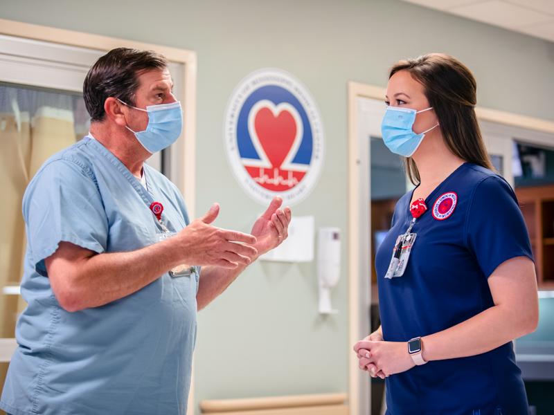 Cardiac Intensive Care Unit nurse manager Don Horn talks with future CICU nurse Makenzie Byrd.