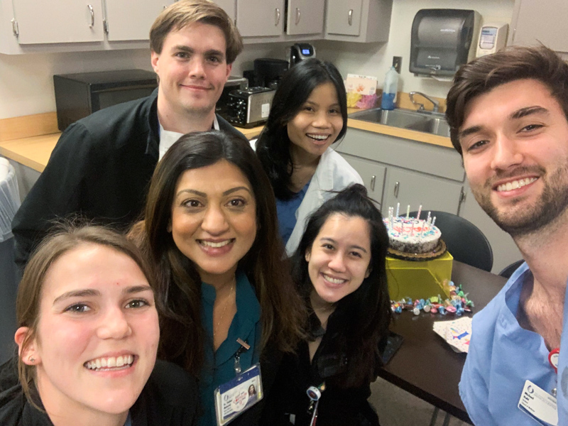 During her pediatric rotation, Phuong Le, back row, right, is among those celebrating the birthday of Dr. Victoria Dao, pediatric resident (standing directly in front of Le). Beside Le is Dr. Shawn Deas, anesthesiology resident; also, from left, are medical student Jessie Smith; Dr. Yasheeka Maharaj, pediatric resident; (Dao) and medical student Michael Hohl. (Photo courtesy of Phuong Le)