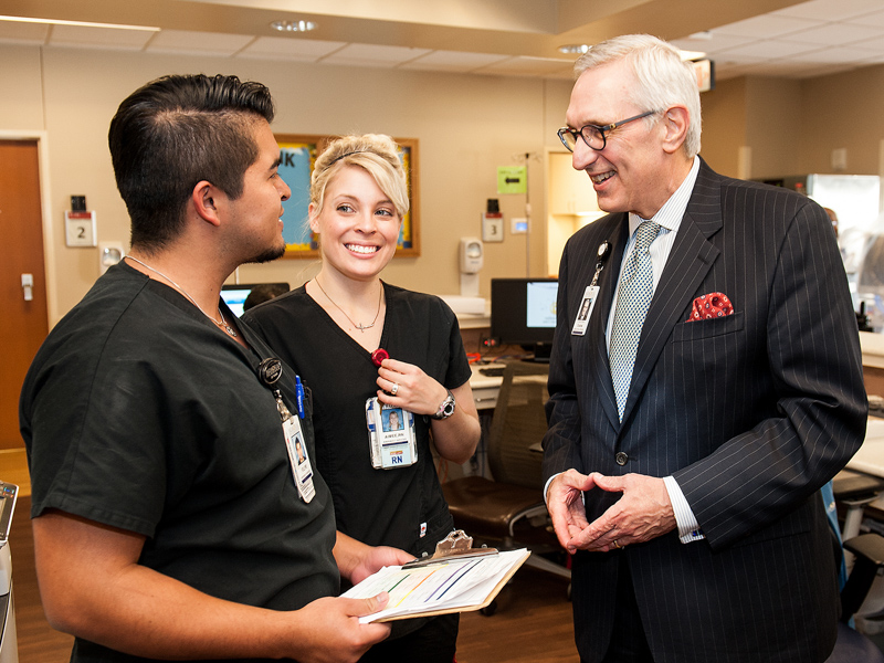 Chuck Stokes, right, the School of Nursing's 2021 Alumnus of the Year, calls nursing a "fabulous career" with "endless" opportunities. (Photo courtesy of Memorial Hermann Health System, Houston, Texas.)