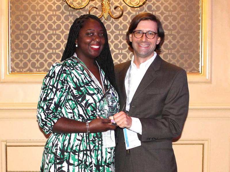 LaRonda Manuel receives the Mississippi Pharmacists Association 2021 Pharmacy Technician of the Year from Dr. Peyton Herrington, incoming MPhA president and a clinical pharmacy specialist with whom she works at UMMC.