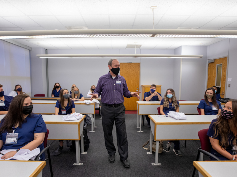 Dr. Lee Brown, assistant professor, talks with incoming radiological science students during orientation Thursday.