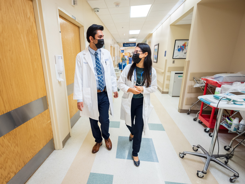 Dr. Prakhar Vijayvargiya, left, and Dr. Zerelda Esquer Garrigos, both assistant professors in the Department of Medicine’s Division of Infectious Diseases, work hand-in-hand with UMMC’s transplant team to manage the care of that infection-prone patient population.