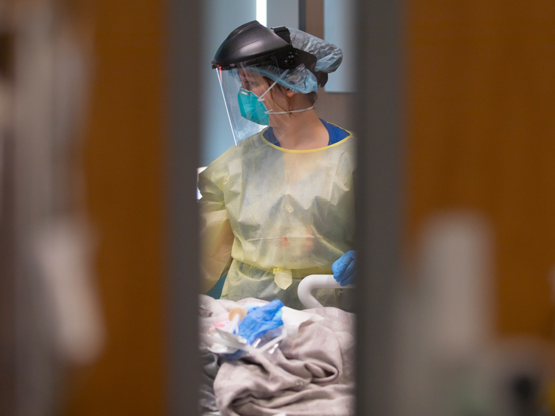 Registered Nurse Abagael Mathis checks on a COVID-19 patient in pediatric intensive care at Children's of Mississippi.