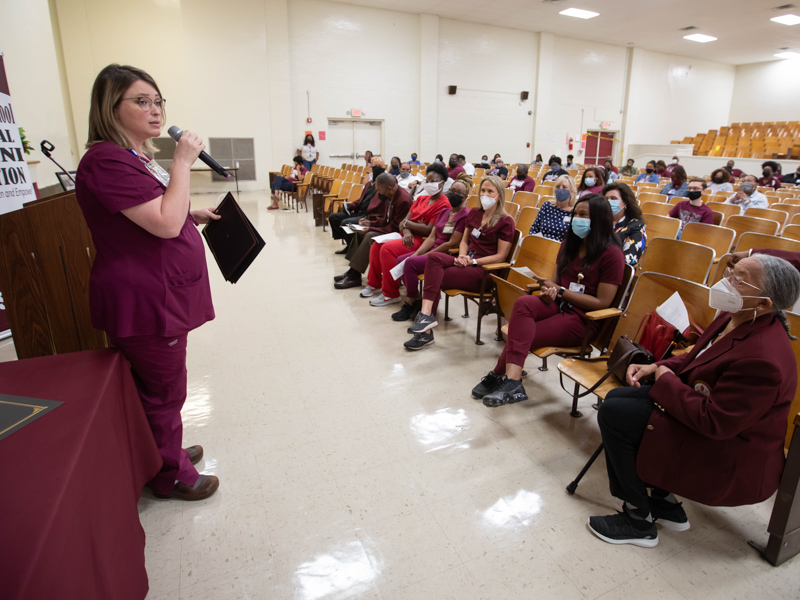 UMMC Nurse Practitioner Dr. Kayla Carr speaks during a presentation for the 2021 Governor's Award of Distinction presented to Lanier High School and its providers.