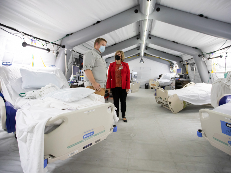 Dr. Elliot Tenpenny, director of Samaritan's Purse's international health unit, gives Woodward a tour of the Samaritan's Purse field hospital.