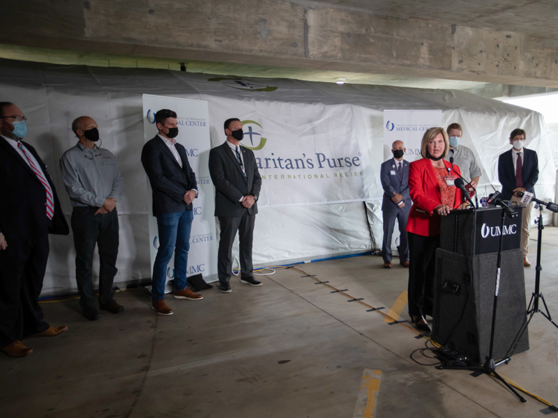 Dr. LouAnn Woodward, vice chancellor for health affairs and dean of the School of Medicine, speaks at her second field hospital opening in less than a week.