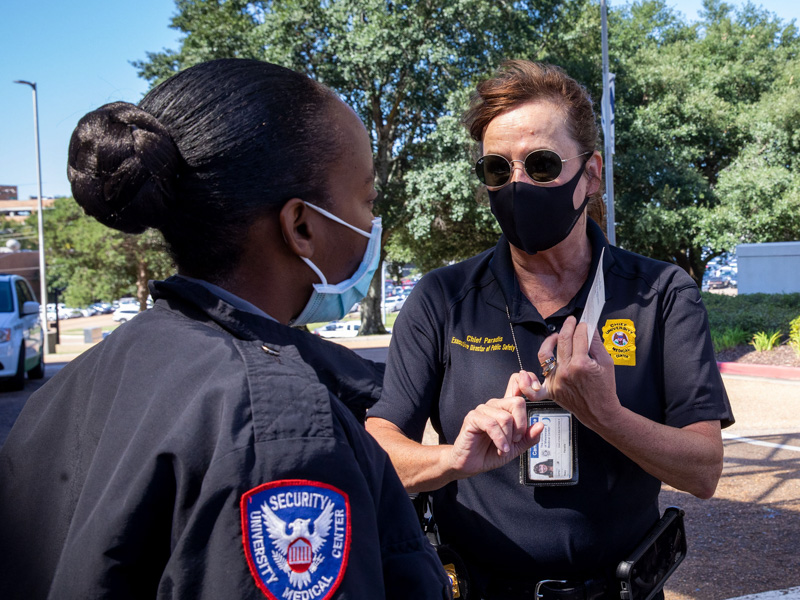 UMMC Police Chief Mary Paradis, center, talks with security officer Queta Buck on patrol.
