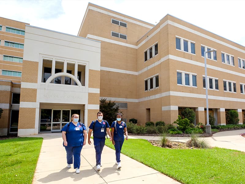 Nursing students, from left, Lillie Jones, Ismaeel Baig and Kierra Brown chat as they leave the School of Nursing at UMMC.