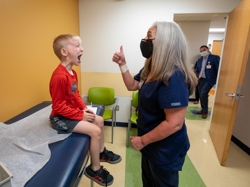 Cooper Beall gets a thumbs up from speech-language pathologist Kara Gibson, one of the experts seeing him at a recent visit to Children's of Mississippi's multidisciplinary cleft clinic.