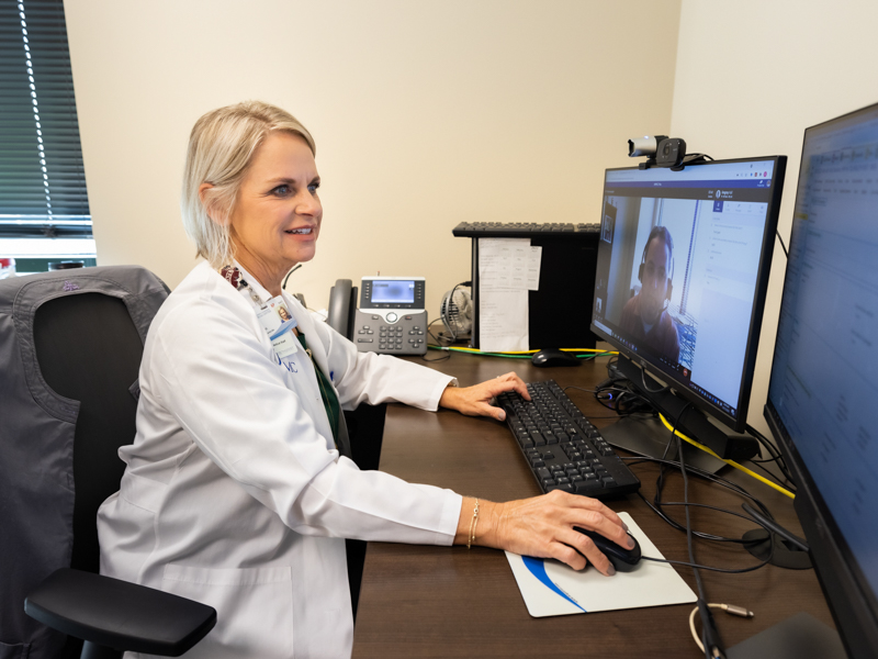 Center for Telehealth nurse practitioner Kristi Goodson chats with patient Greg Hall during a UMMC 2 You appointment. Hall also is a Center for Telehealth employee, serving as director of telehealth IT.