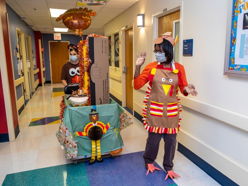 Child life assistant Michelle Chambers, right, and medical student Mallory Harmon share Thanksgiving greetings to Children's of Mississippi patients and families.