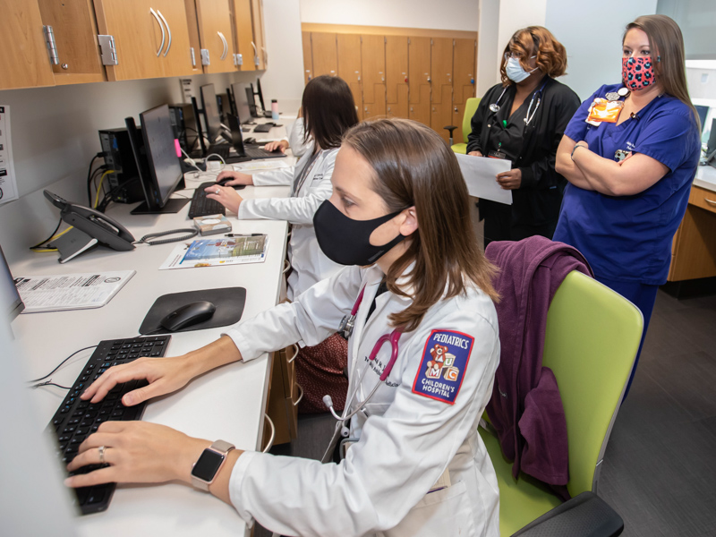 Dr. Sarah Jones, left, respiratory therapist Latanya Lee and nurse care coordinator Abby Becklehimer review cases in the Complex Care Clinic at the Kathy and Joe Sanderson Tower at Children's of Mississippi.