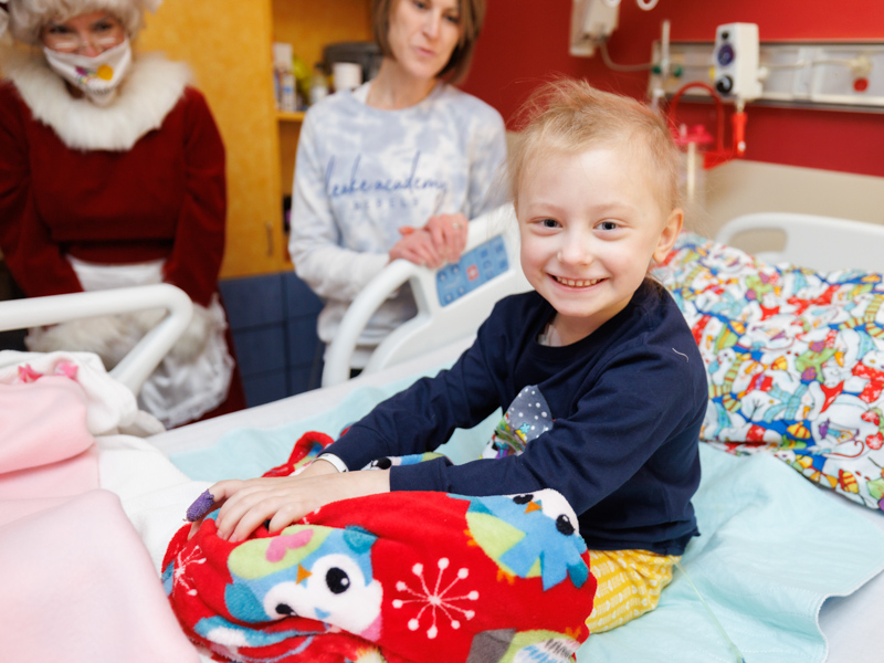 Mary Mosley Pickering, a patient in the Children's of Mississippi, is thrilled to get a visit from Santa and Mrs. Claus.