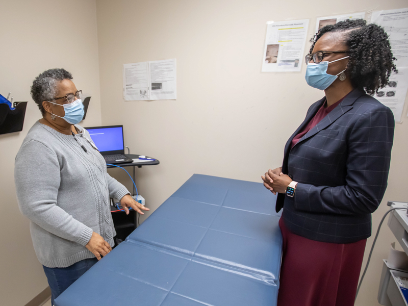 Carson, right, talks with Registered Nurse Dorothy Horton in a participant exam room at the Jackson Medical Mall. The JHS will meet with 2,000 participants over a two-year period to learn more about their health.