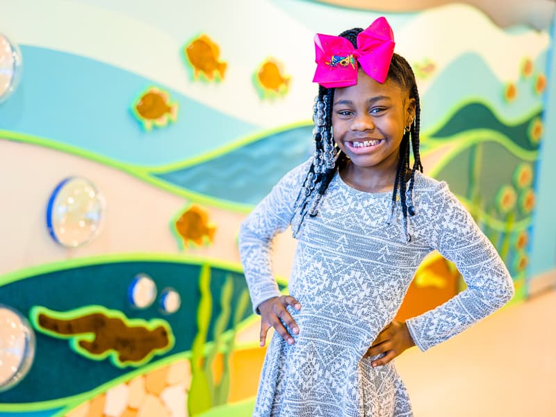 Mississippi's 2022 Children's Miracle Network Hospitals Champion Nolee Jones smiles while visiting the Mississippi Children's Museum.