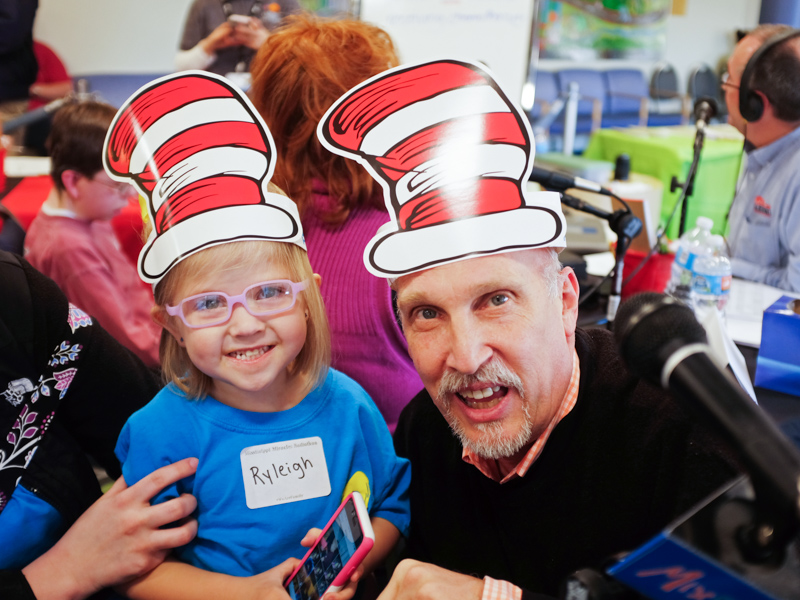 In this file photo from 2016, Mix 98.7 program director and on-air personality John Anthony, a perennial Mississippi Miracles Radiothon broadcaster, smiles with Children's of Mississippi patient Ryleigh Sayers.