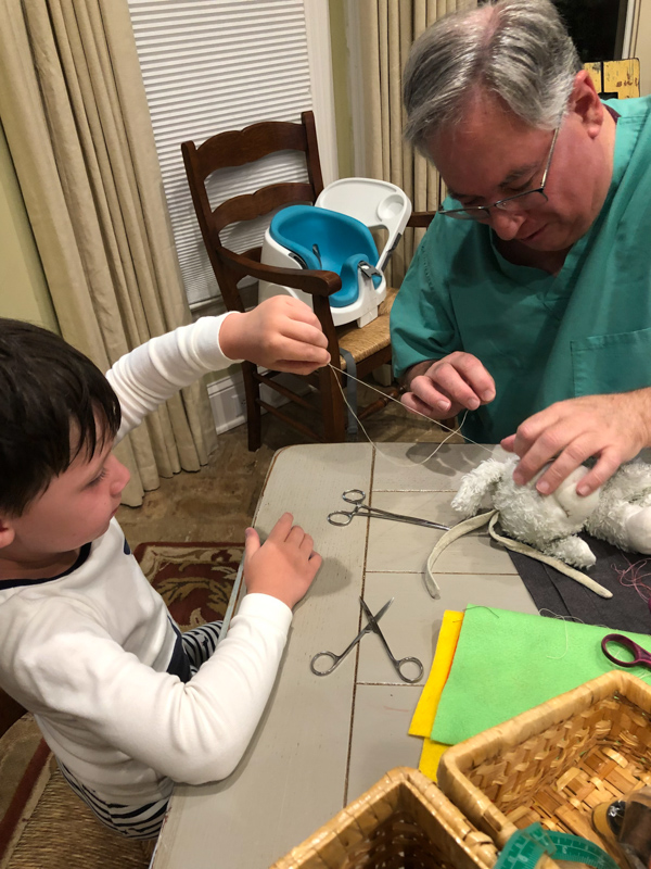 Didlake and grandson Liam stitch together a stuffed lamb. "I never would have predicted that I would have become an engaged grandparent," Didlake says.