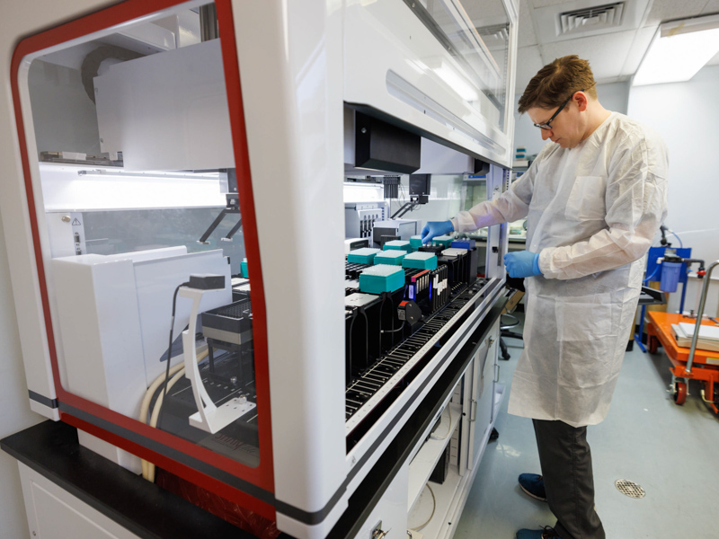 Daniel Waltman, molecular pathology specialist, prepares plates loaded with DNA fragments, known as a library, before the samples go onto the next-generation sequencing machine.